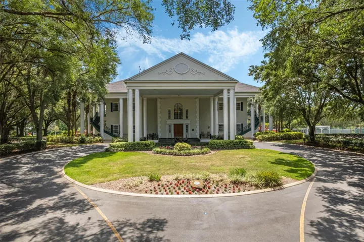 Community amenity: columned clubhouse with a circular drive