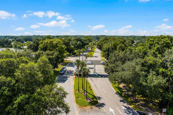 Community amenity: aerial view of the tree-lined main entrance