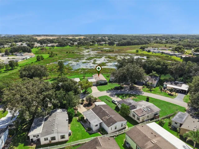 Aerial view across the neighborhood with the home marked