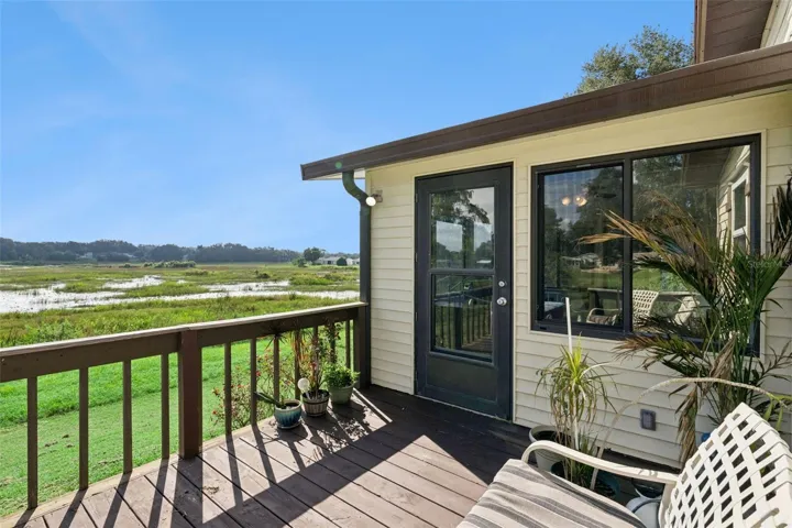 Rear deck off the sunroom overlooking the open marsh