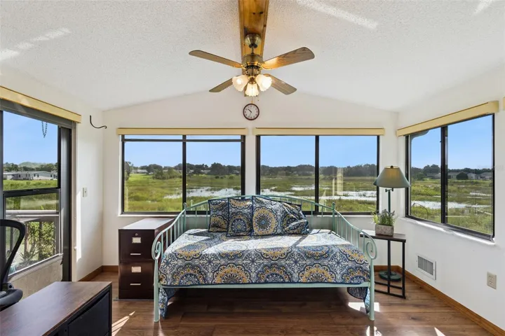 Sunroom with wide windows overlooking the open marsh
