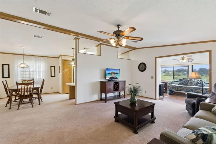 Open living area connecting the dining room and the sunroom