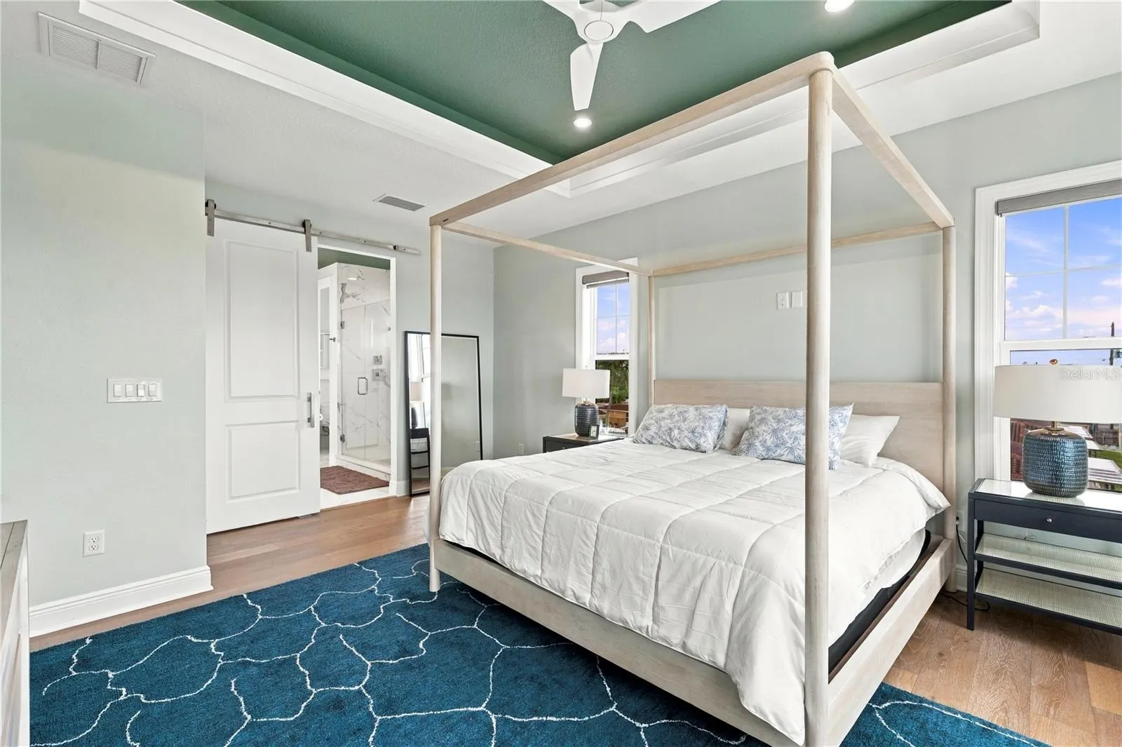 master bedroom with en-suite bathroom and walk in closet