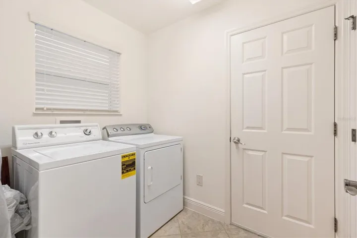 Inside laundry room with storage closet.