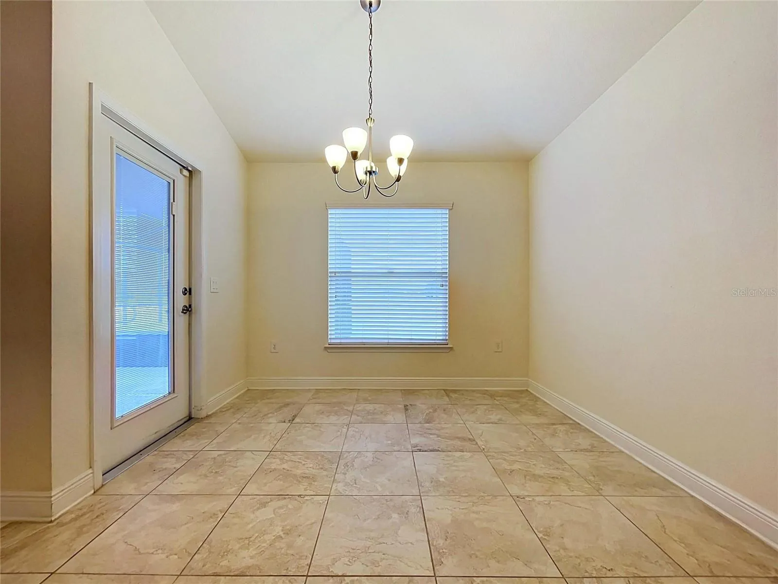 DINING AREA WITH DOOR TO BACK PATIO