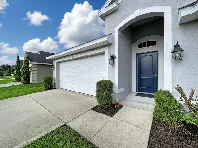 FRONT DOOR WITH CONCRETE ACCESSIBILITY ENTRANCE
