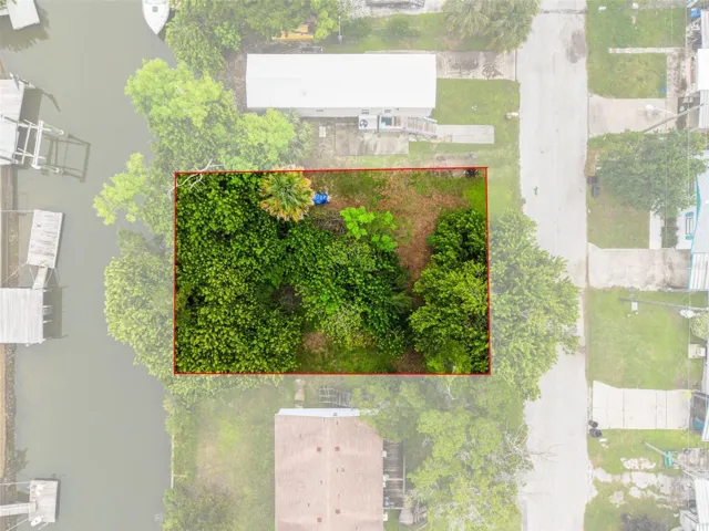 Top-down aerial view highlighting the approximate lot boundaries and waterfront setting.