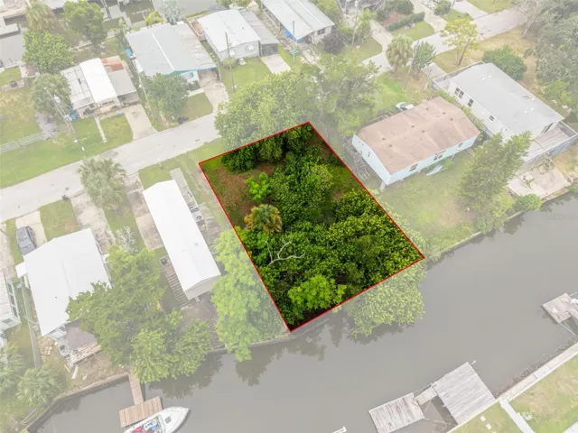 Outlined aerial view showcasing the approximate lot boundaries and canal frontage.