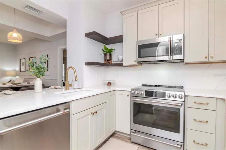 Updated Kitchen with Custom Cabinetry, GE Cafe' Appliances, &amp; Quartz Countertops