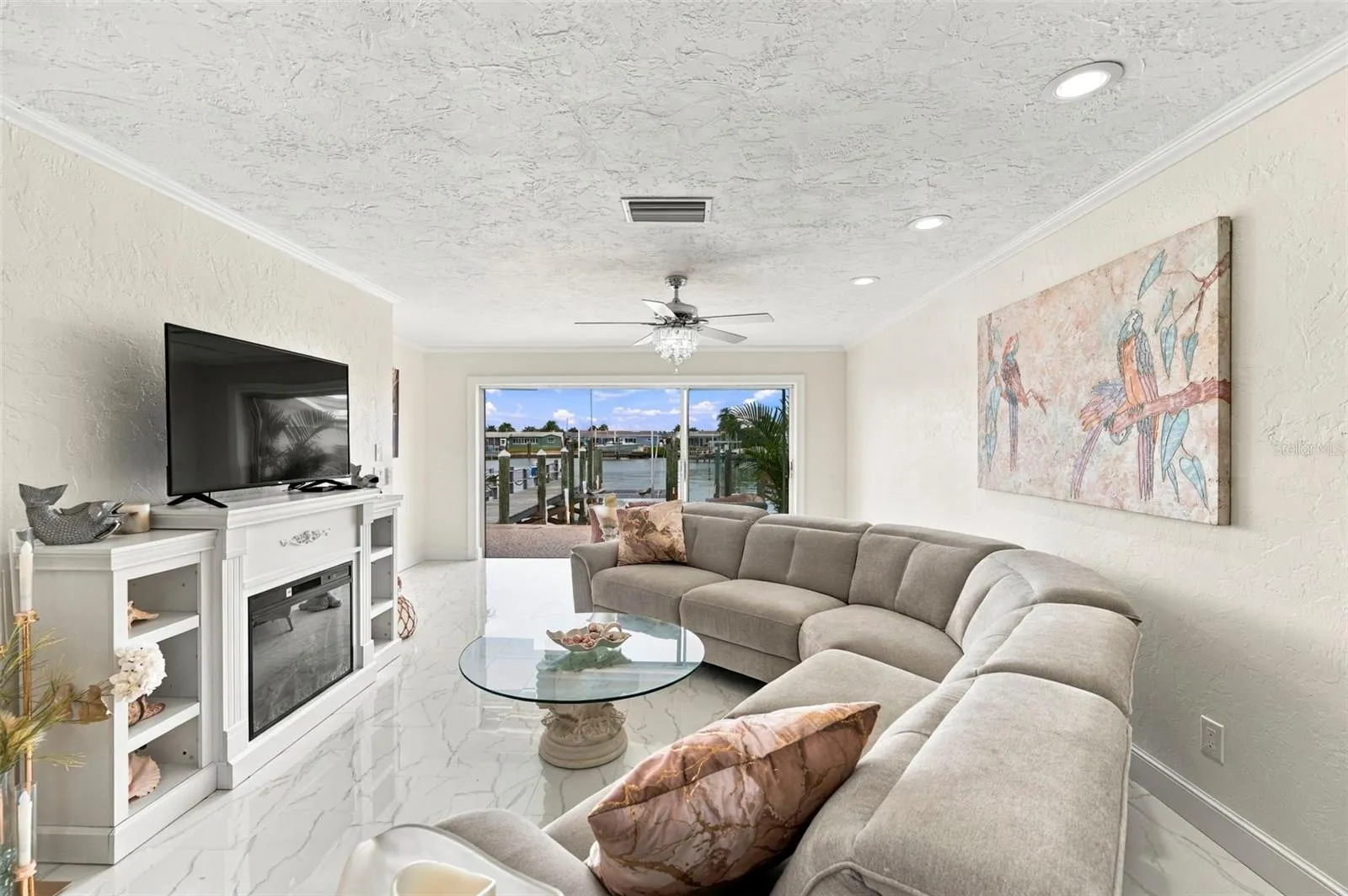 Water view from the Kitchen, Dining Room, Living Room, and Primary Bedroom!