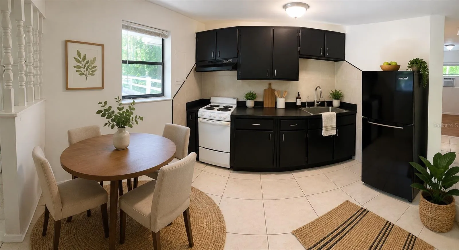 Bright, open-concept kitchen featuring an adjoining dining area.