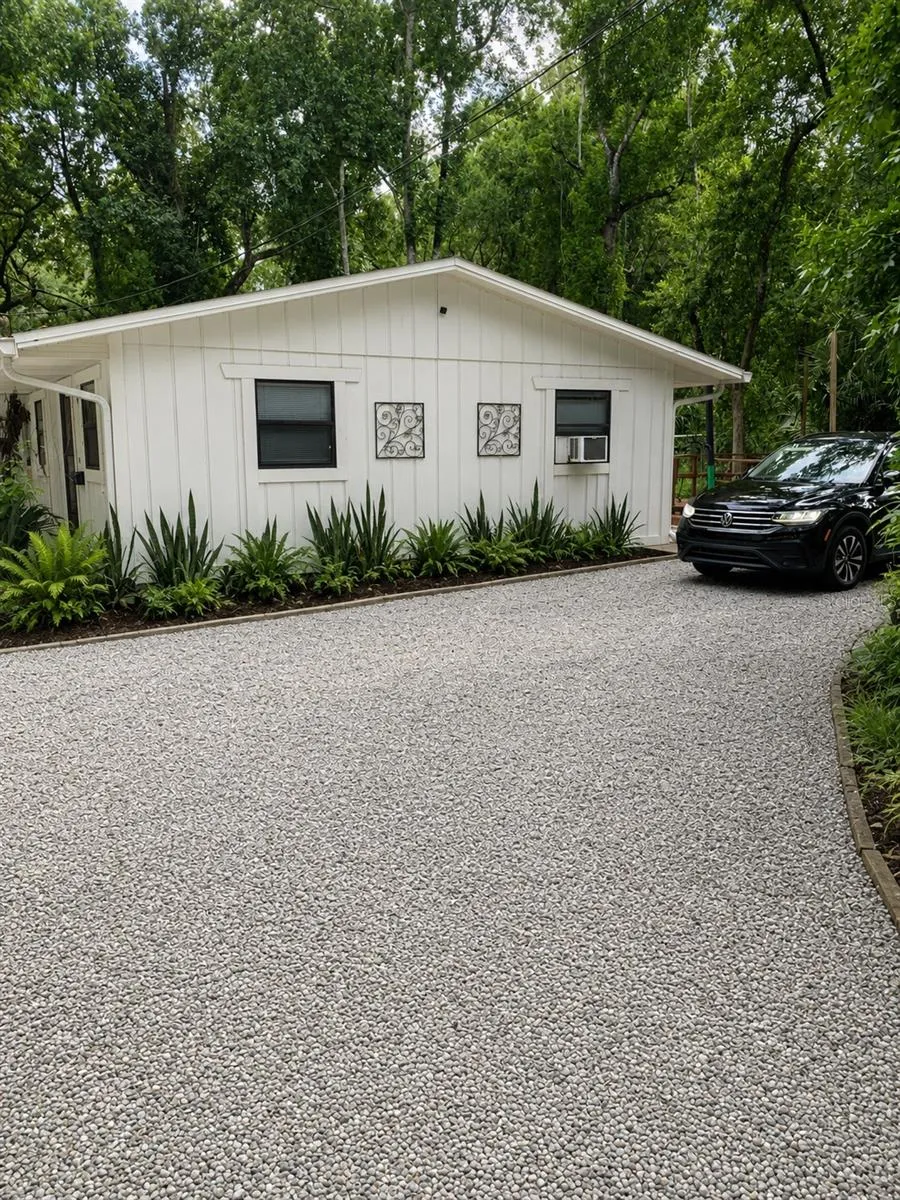 Exterior view of the cottage, showcasing the private parking area.