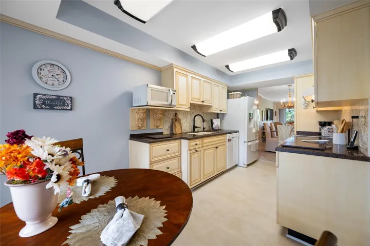 Custom cabinetry.  Appliances included, French door Refrigerator, Dishwasher, and Counter Microwave.and Range