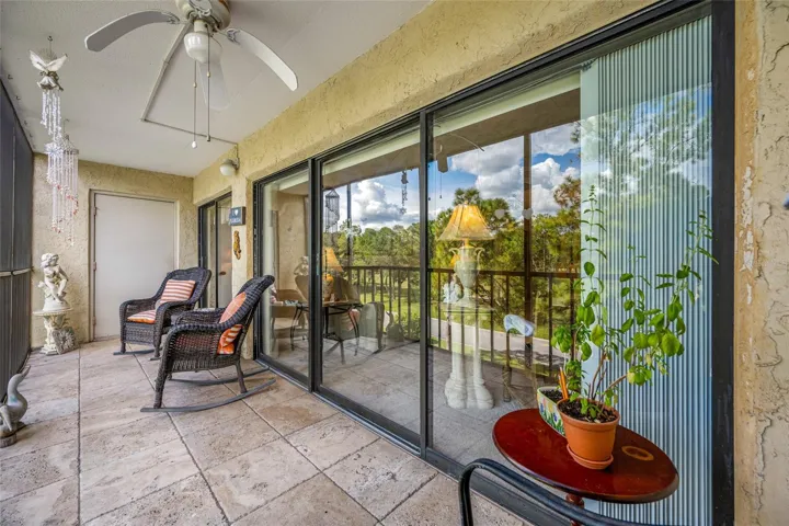 Lanai with sliding door access to living area and primary bedroom