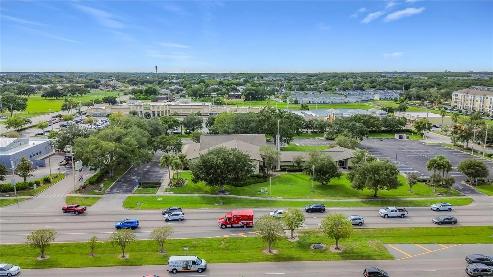 Surrounding businesses and green spaces.