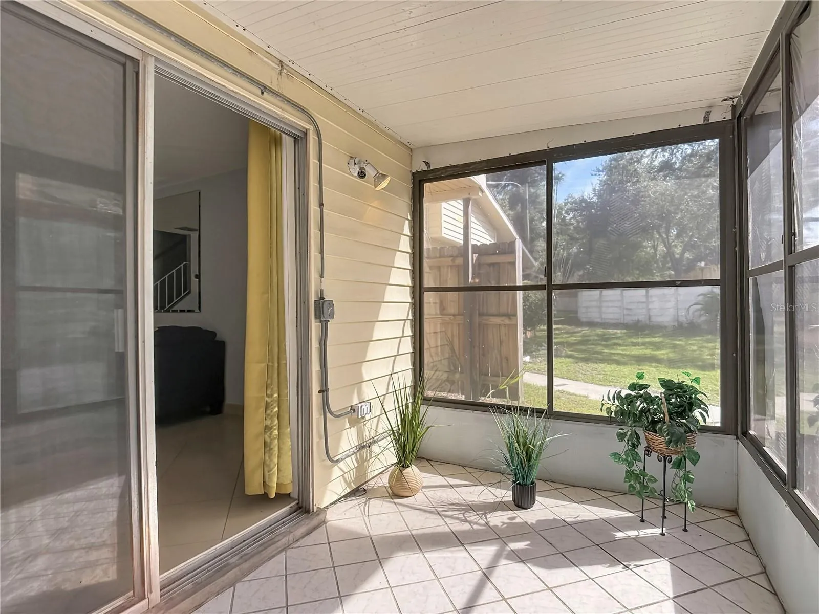 Screened porch with sliding-door access.