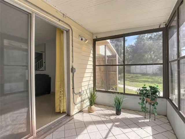 Screened porch with sliding-door access.