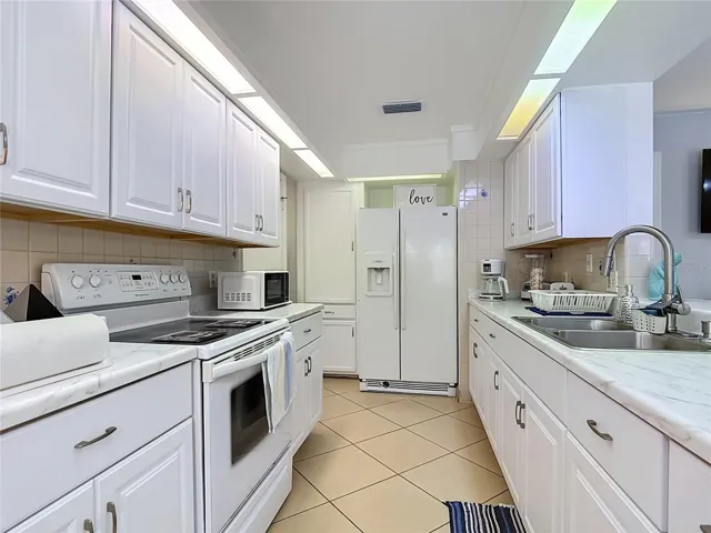 Updated kitchen with white cabinetry