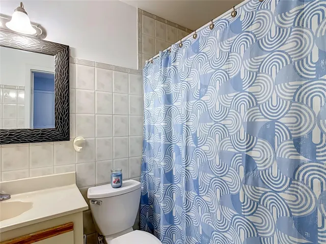 Full bathroom with tub and shower.