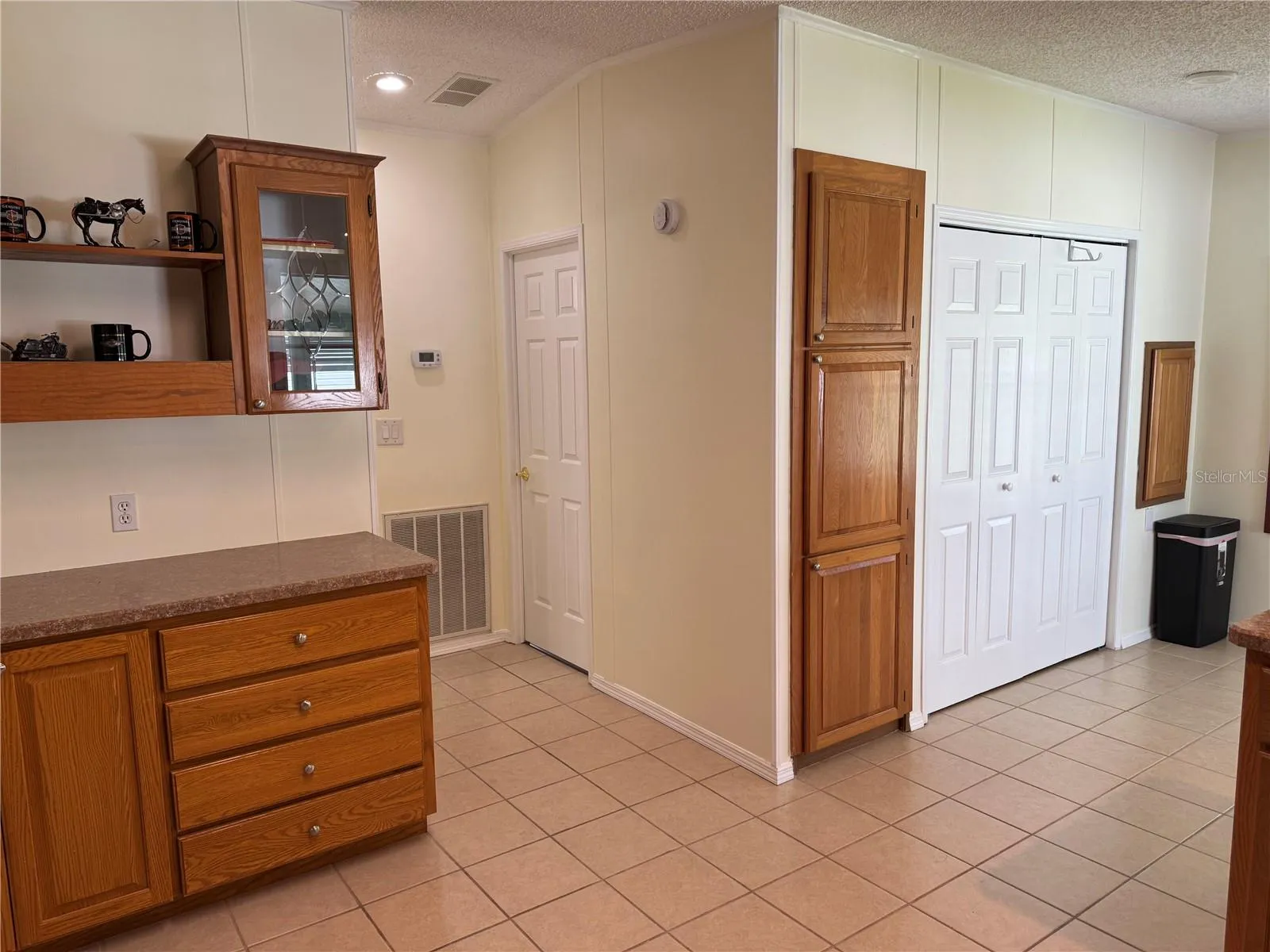 Kitchen with hall to guest bath and  bed