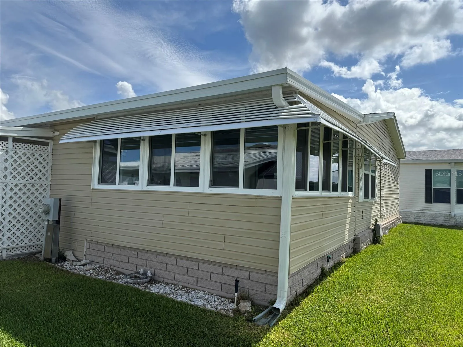 Rear view -Florida Room that looks over golf course