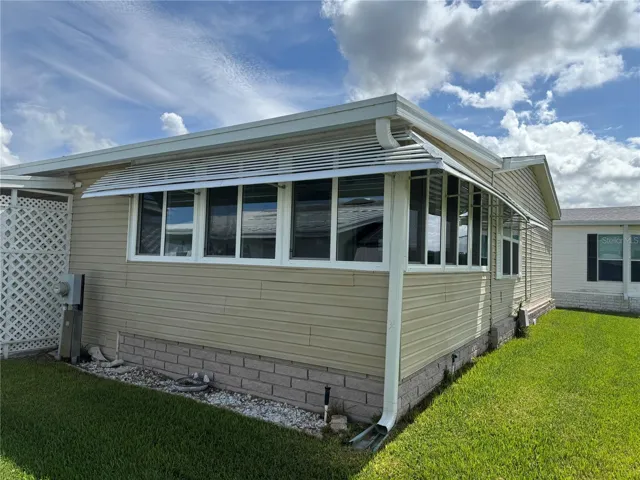 Rear view -Florida Room that looks over golf course