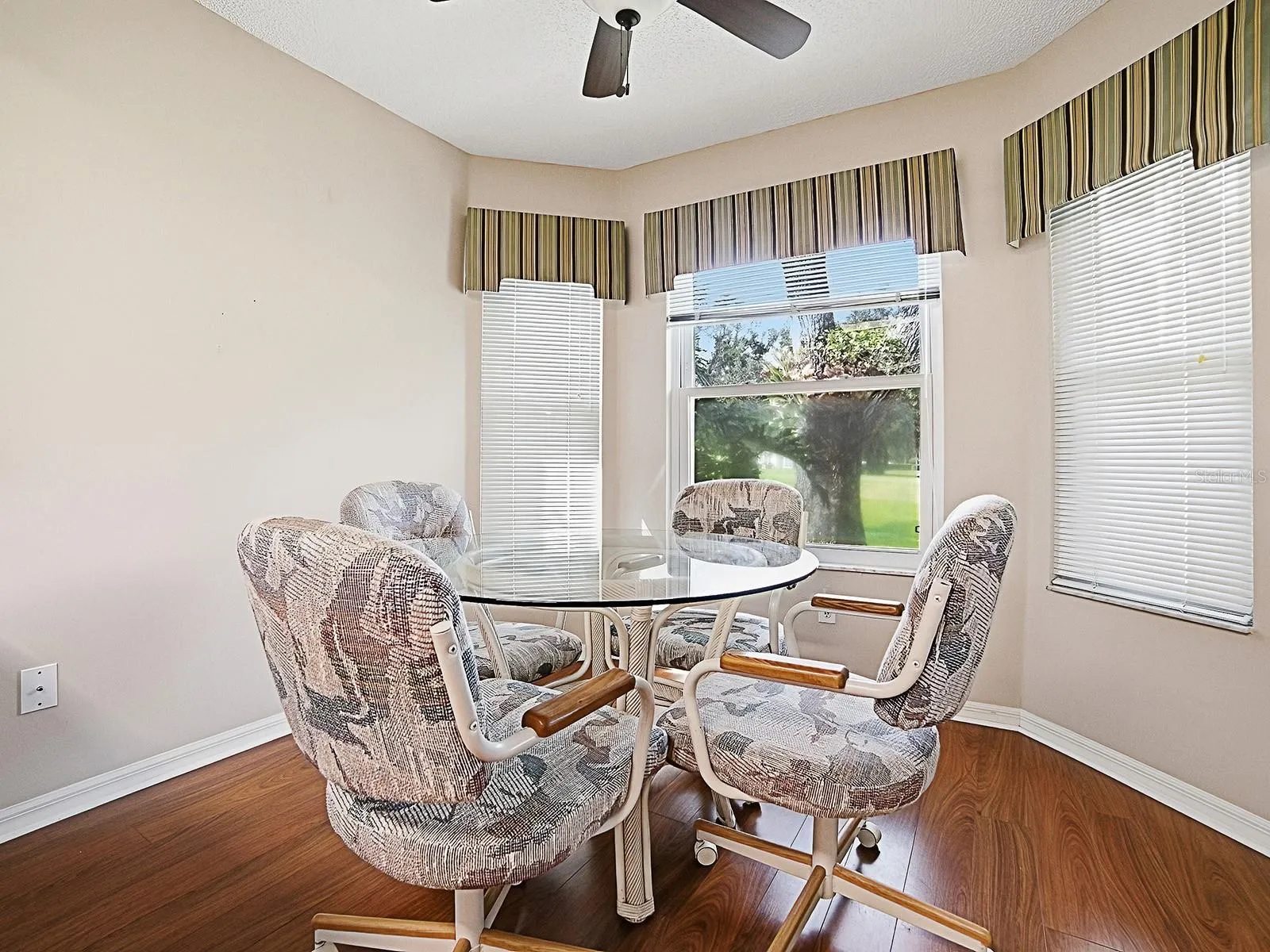 NATURAL LIGHT SHINES THROUGH YOUR EAT IN DINING AREA