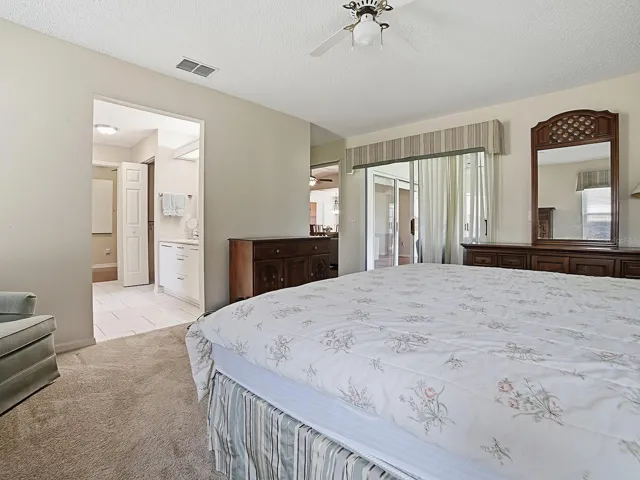 PRIMARY BEDROOM WITH SLIDERS TO THE LANAI