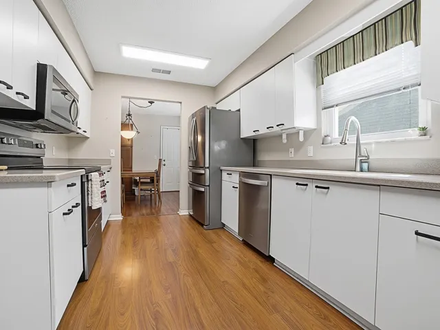 KITCHEN WITH NEWER STAINLESS STEEL APPLIANCES
