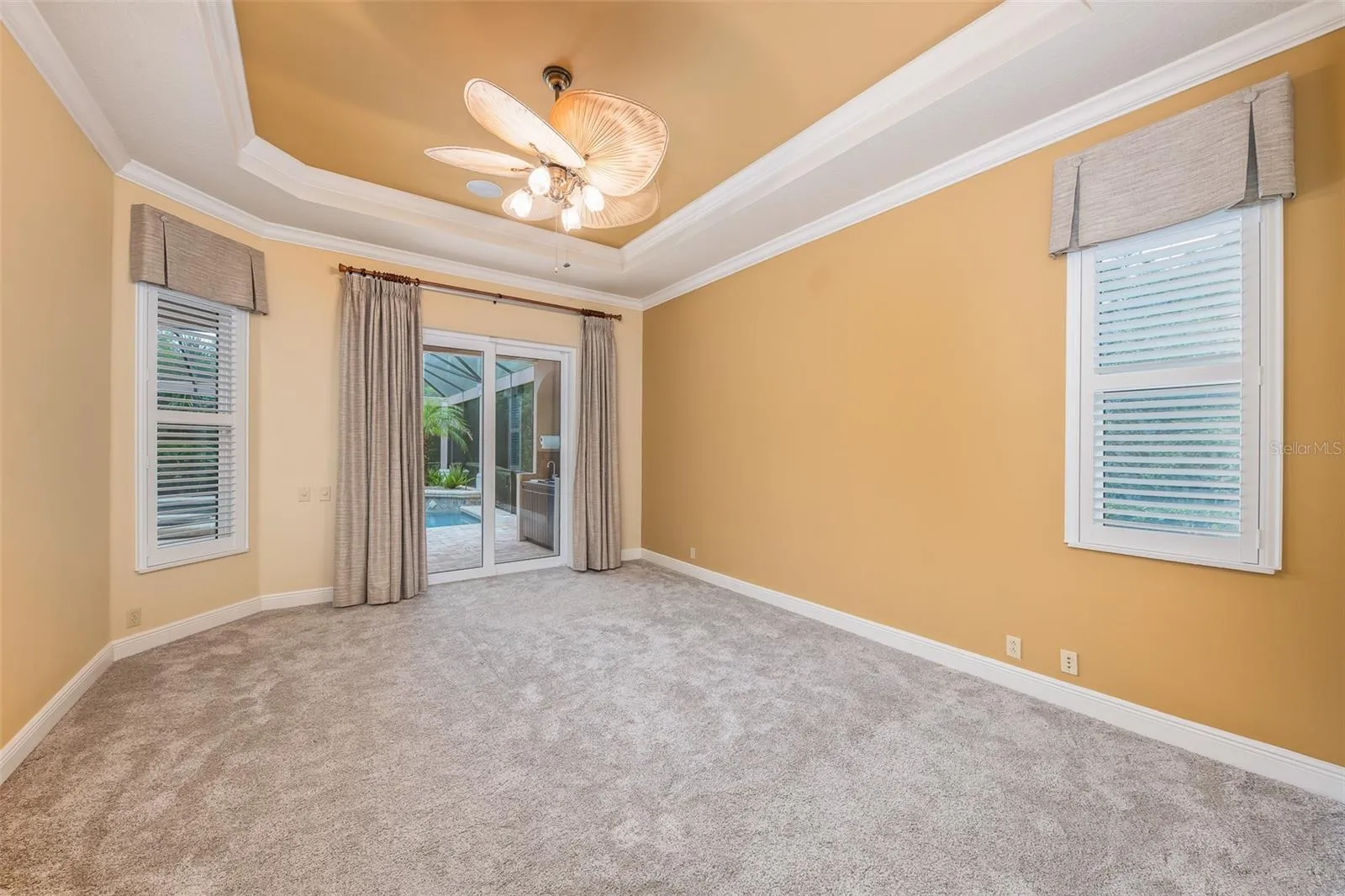 Primary bedroom with patio/pool access