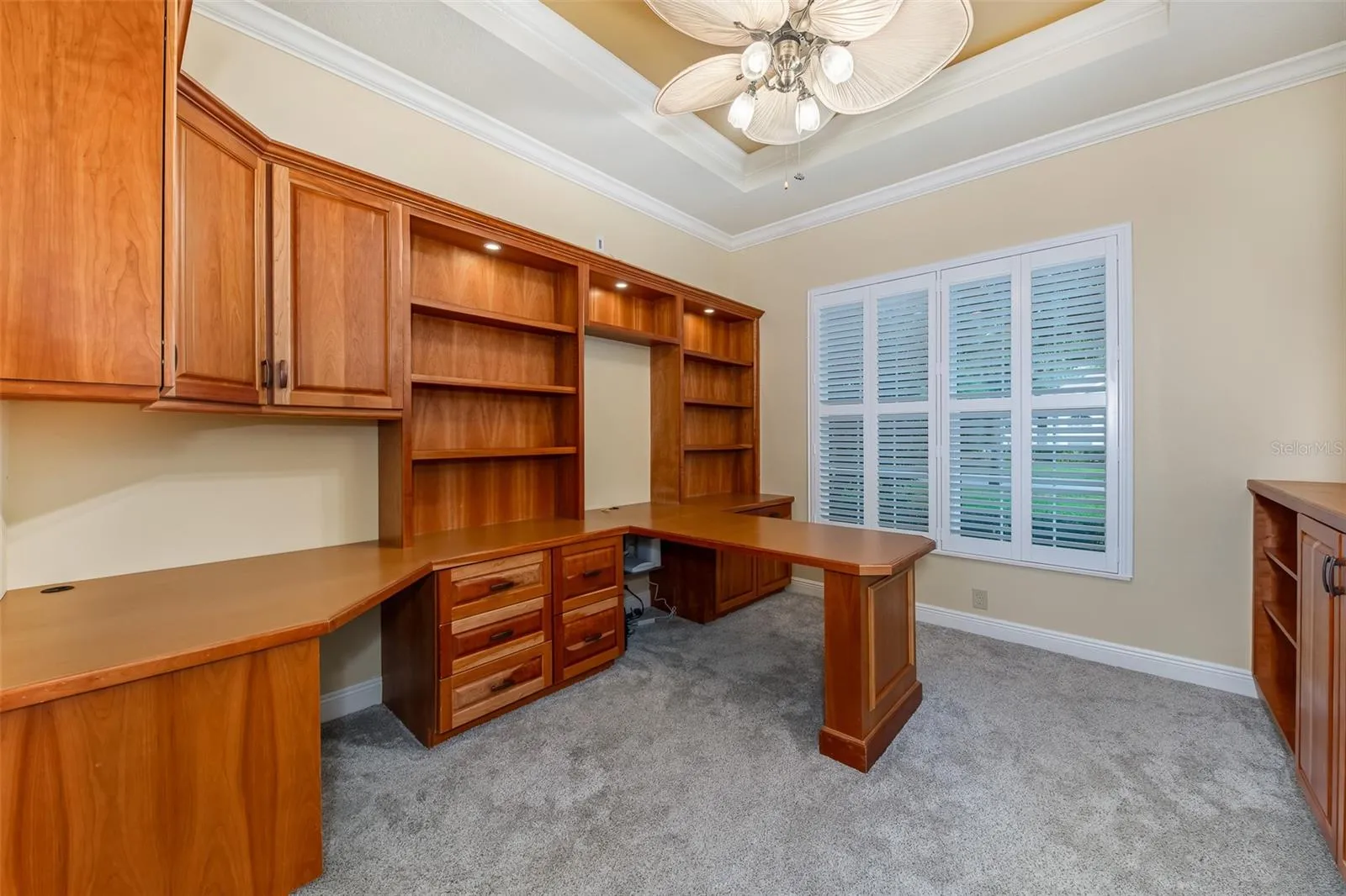 Executive office with built in desk and shelving plus full closet