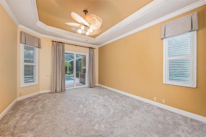 Primary bedroom with patio/pool access