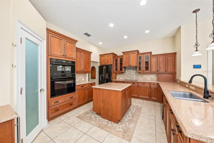 Well-appointed kitchen with center island, newer appliances and walk-in pantry