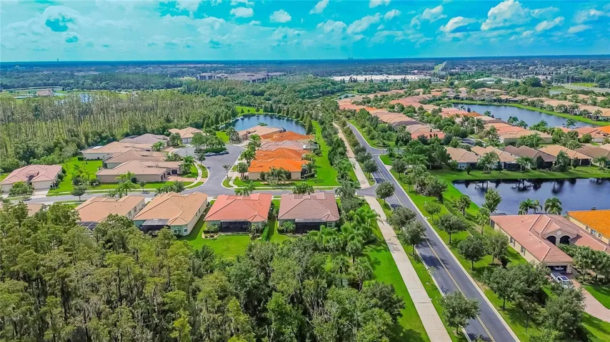 Exterior Rear Aerial Toward South Community Gate Entrance