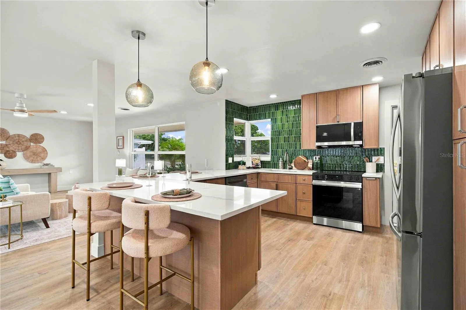 Open kitchen with quartz counters.