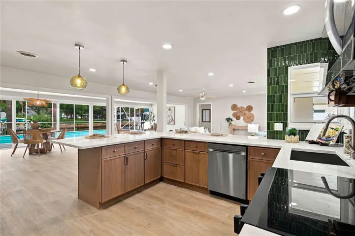 kitchen looking into the great room with views of the pool and canal.