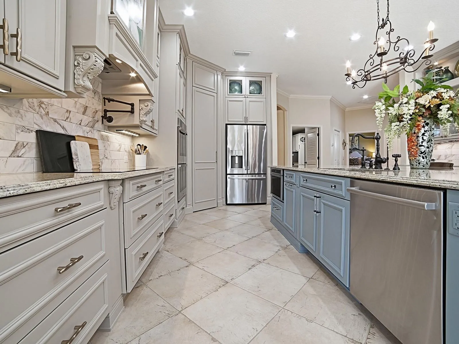 NEW CABINETRY, GRANITE COUNTERTOPS, STAINLESS APPLIANCES WITH 5 BURNER COOKTOP, HOOD, AND MICROWAVE DRAWER, POT DRAWERS, LIGHTING ............