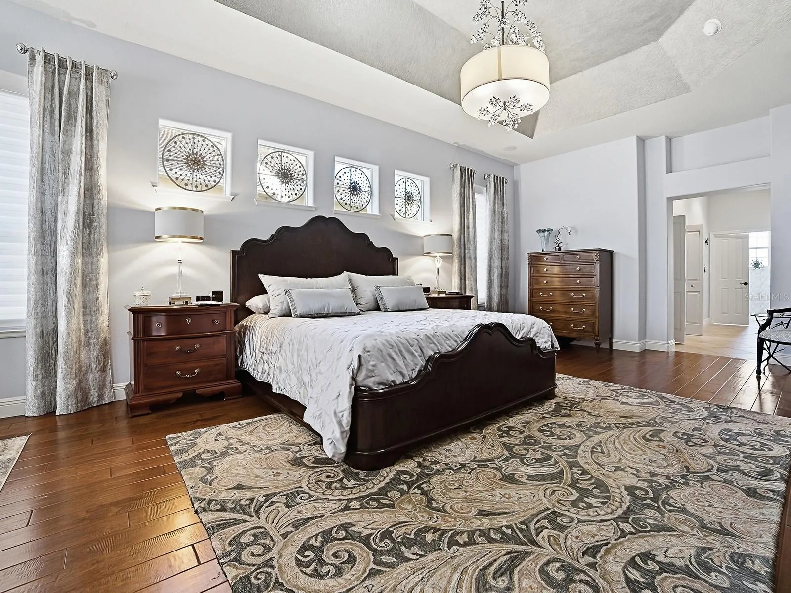 TO THE RIGHT IS THE HALLWAY LEADING TO YOUR EN-SUITE BATH WITH SPACIOUS CLOSETS AND BUILT-INS!