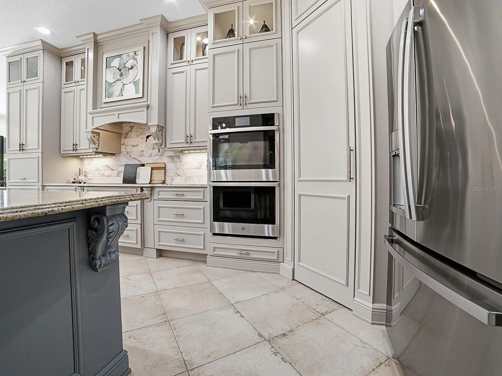 WALL OVENS AND A WALK-IN PANTRY WITH CUSTOM SHELVING AND POT FILLER!