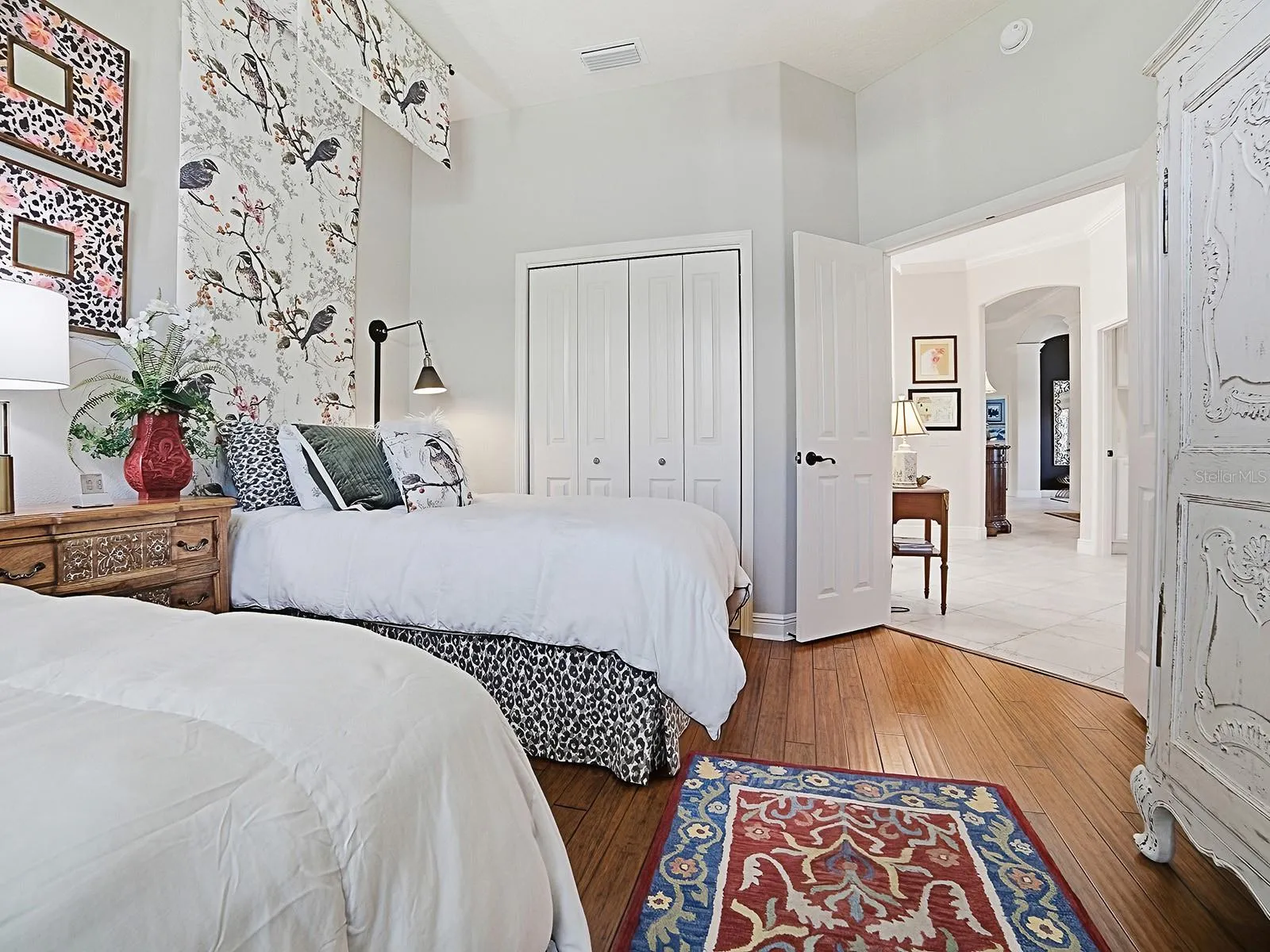 THIS ROOM ALSO HAS A DOUBLE DOOR CLOSET WITH BUILT-INS.