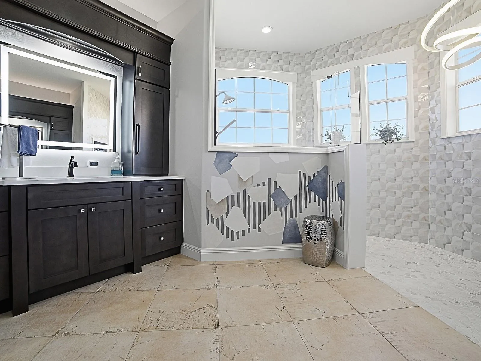 BEAUTIFUL RENOVATED BATH WITH WALK-N SHOWER WITH SHAVING MIRROR, LIGHTED MIRRORS, AND EVEN ELECTRICITY IN THE CABINETS FOR HAIRDRYERS AND SMALL APPLIANCES.