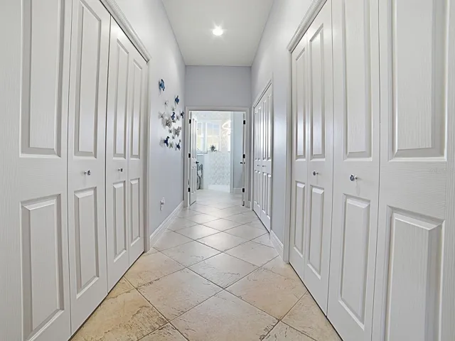 LARGE WALK-IN CLOSET ON THE LEFT WITH SOLAR TUBE, AND ON THE RIGHT MORE CLOSET SPACE. THE 2ND SET OF DOUBLE DOORS ON THE RIGHT HAS MORE STORAGE AND 2ND WATER HEATER - CONVENIENT FOR THIS SIDE OF THE HOME.
