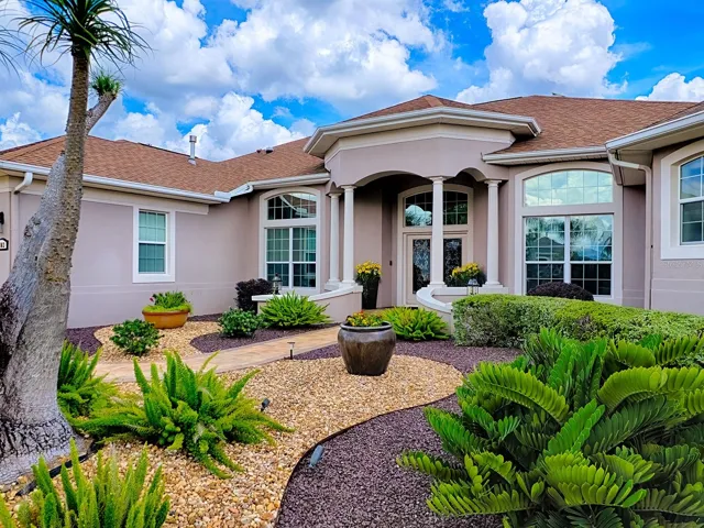 THERE IS CUSTOM LANDSCAPING AROUND THE ENTIRE HOME FOR EASY MAINTENANCE AND LOVELY CURB APPEAL.