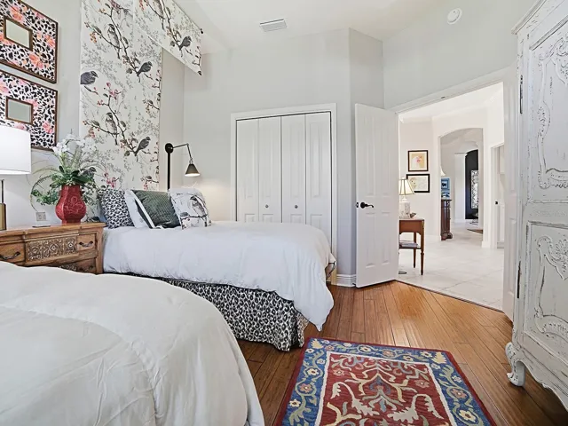 THIS ROOM ALSO HAS A DOUBLE DOOR CLOSET WITH BUILT-INS.