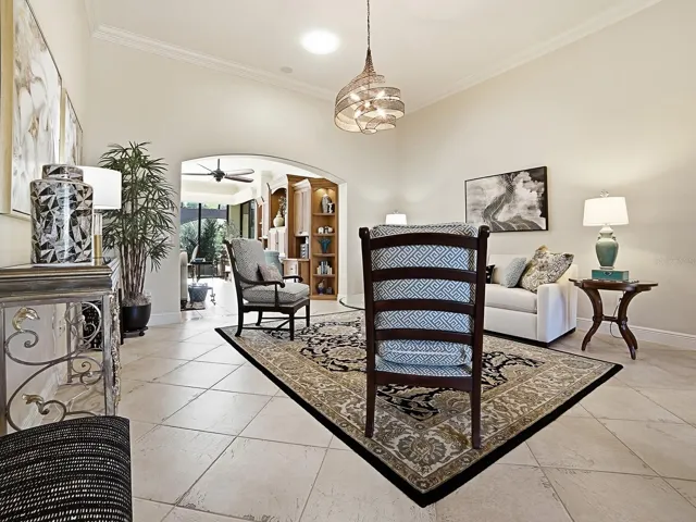 FROM THE FOYER, STEP INTO YOUR FORMAL LIVING ROOM THAT FLOWS INTO THE ADDED BONUS AREA AND FAMILY ROOM.