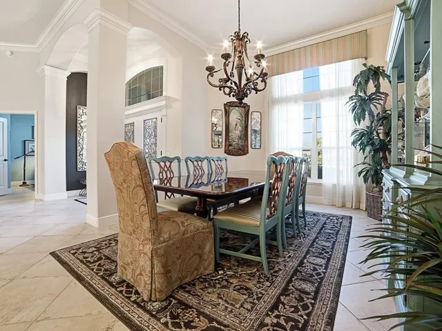 GREAT FOR ENTERTAINING WITH BEAUTIFUL CHANDELIER, VALANCE AND CUSTOM DRAPES.