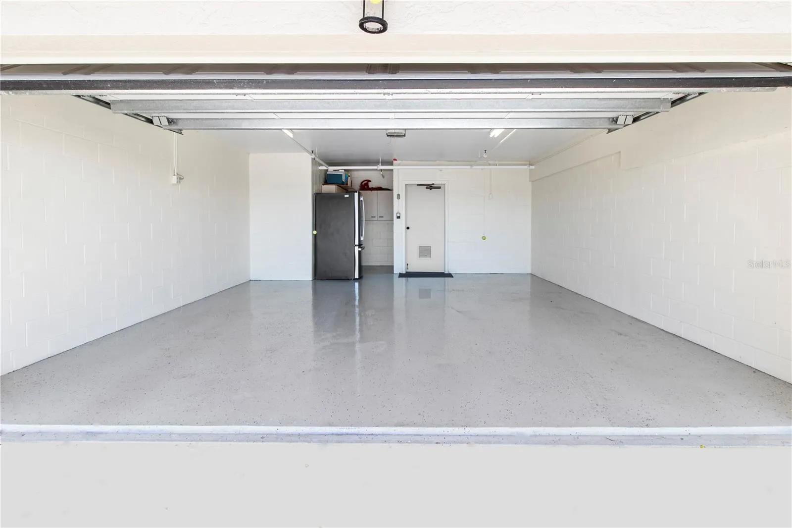 2 Car garage with epoxy floors. Plus extra storage in the garage. Hurricane doors