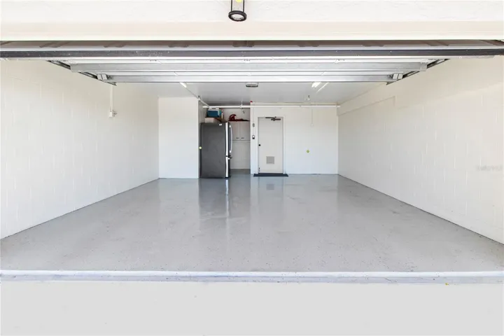 2 Car garage with epoxy floors. Plus extra storage in the garage. Hurricane doors