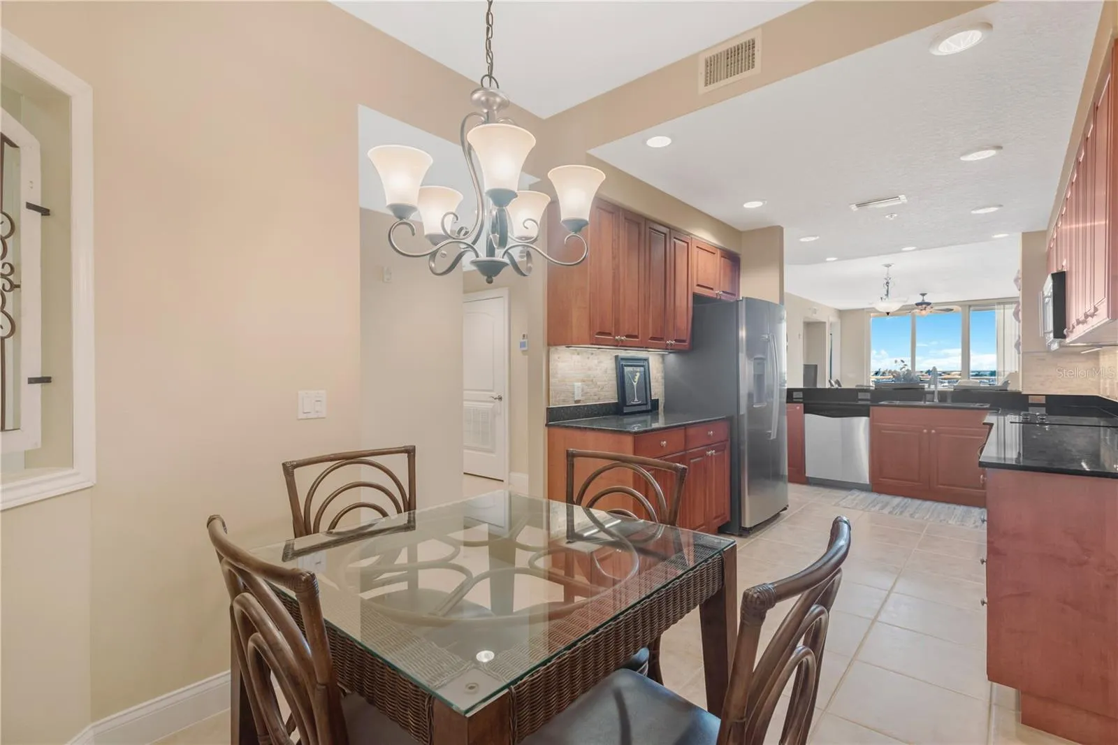 Eat-in Kitchen area.  Stainless steel appliances and new (2025) counter depth Refrigerator.