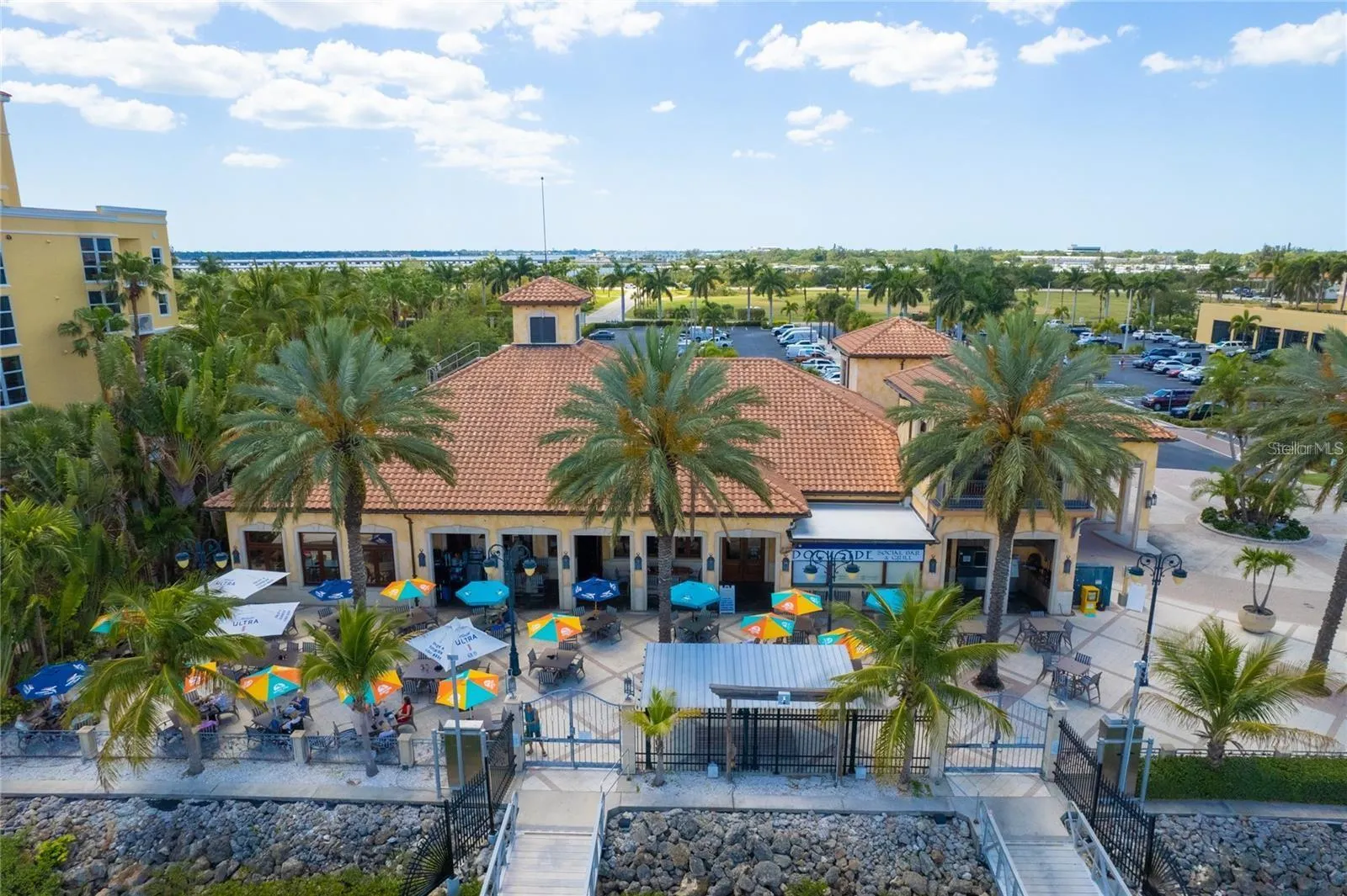 Adjoining Full Service Restaurant - Aerial Patio View - overlooking the Riviera Dunes Marina